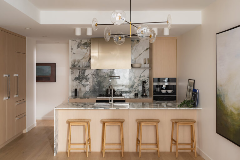 Modern condo kitchen with island and premium finishes in Ashleigh Oakridge Vancouver home